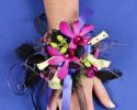 This prom corsage is so fun with the purple flowers, ribbon, wire and feathers.