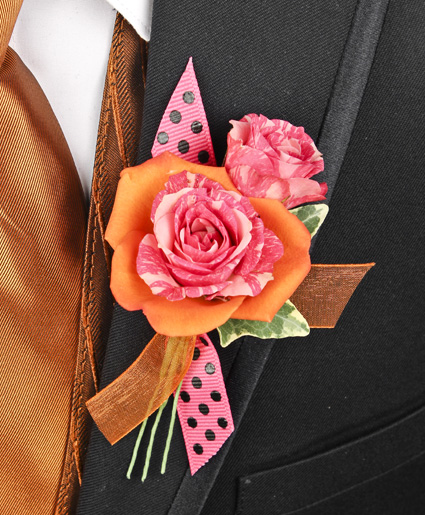 This orange and pink prom corsage features an orange flower with a pink flower inside of it to make a great contrast of colors. Plus, the added accent of the polka dot & orange ribbon makes it stand out.