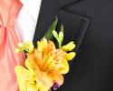 This bright yellow boutonniere is great with the yellow flower and accent of purple ribbon.