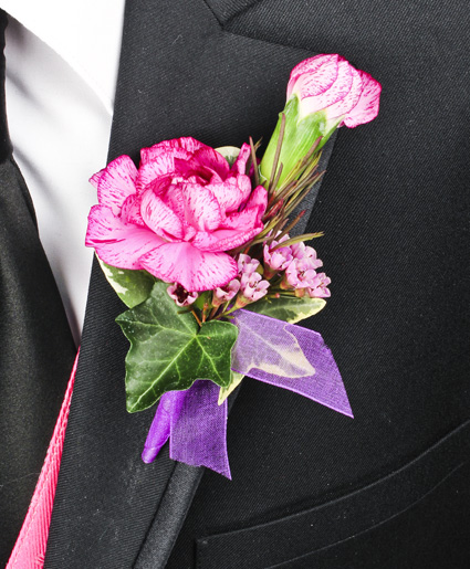 This colorful pink and purple prom boutonniere features a single pink flower with the accent of purple ribbon.  